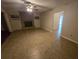 Living room with tile floors and a view into another room at 3414 Portersfield Rd, Orlando, FL 32808