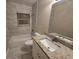 Updated bathroom with granite vanity and a tiled shower/tub at 3414 Portersfield Rd, Orlando, FL 32808