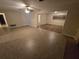 Spacious living room featuring tile floors and a brick fireplace at 3414 Portersfield Rd, Orlando, FL 32808