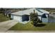 House front view, solar panels and landscaping at 612 Chicago Way, Dundee, FL 33838