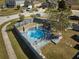 Circular pool with surrounding deck and landscaping at 612 Chicago Way, Dundee, FL 33838