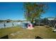 Backyard with playhouse, trampoline, and swing set at 612 Chicago Way, Dundee, FL 33838