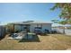 Backyard with pergola, deck, and grill at 612 Chicago Way, Dundee, FL 33838