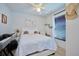 Bedroom with a queen-size bed, rainbow wall art, and a keyboard at 612 Chicago Way, Dundee, FL 33838