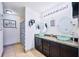 Double vanity bathroom with glass sinks and large mirrors at 612 Chicago Way, Dundee, FL 33838
