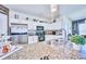 Modern kitchen with stainless steel appliances and granite countertops at 612 Chicago Way, Dundee, FL 33838