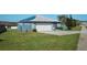 One-story house with attached garage and solar panels at 612 Chicago Way, Dundee, FL 33838