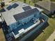 Elevated deck with furniture and solar panels on the roof at 612 Chicago Way, Dundee, FL 33838
