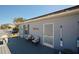 Side yard deck with seating and coastal decor at 612 Chicago Way, Dundee, FL 33838