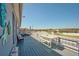 Relaxing deck with seating area, table, and coastal decor at 612 Chicago Way, Dundee, FL 33838