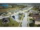 Aerial view of a residential neighborhood with houses and a lake at 612 Chicago Way, Dundee, FL 33838