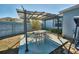 Covered patio area with table and chairs at 612 Chicago Way, Dundee, FL 33838