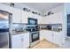 Modern kitchen with stainless steel appliances and granite countertops at 612 Chicago Way, Dundee, FL 33838