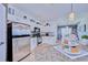 Updated kitchen featuring stainless steel appliances and granite countertops at 612 Chicago Way, Dundee, FL 33838