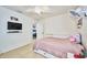 Bedroom with full-size bed and access to living area at 612 Chicago Way, Dundee, FL 33838