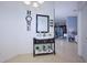Inviting entryway with console table and mirror reflecting the living area at 612 Chicago Way, Dundee, FL 33838