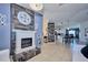 Open living space with a view of the kitchen and fireplace at 612 Chicago Way, Dundee, FL 33838