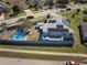 House with solar panels, pool, deck, and fenced backyard at 612 Chicago Way, Dundee, FL 33838