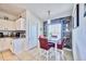 White kitchen with granite countertops and breakfast nook at 612 Chicago Way, Dundee, FL 33838