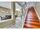 Bright and airy foyer with a wooden staircase leading upstairs at 4615 Cumbrian Lakes Dr, Kissimmee, FL 34746