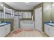 Bathroom with double sinks, shower, and a large soaking tub at 4615 Cumbrian Lakes Dr, Kissimmee, FL 34746