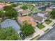 Aerial view of a residential neighborhood with houses and landscaping at 4615 Cumbrian Lakes Dr, Kissimmee, FL 34746