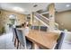 Formal dining room with a large table, gray chairs, and natural light at 4615 Cumbrian Lakes Dr, Kissimmee, FL 34746
