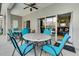 Covered patio with seating area, ceiling fan, and access to the pool at 4615 Cumbrian Lakes Dr, Kissimmee, FL 34746
