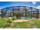 Screened pool and patio with lush landscaping and spacious backyard at 4615 Cumbrian Lakes Dr, Kissimmee, FL 34746