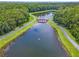 Aerial view of a community featuring a scenic lake and walking paths at 4615 Cumbrian Lakes Dr, Kissimmee, FL 34746