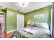 Guest bedroom with a queen bed and leafy bedding at 4615 Cumbrian Lakes Dr, Kissimmee, FL 34746