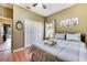 Guest bedroom with full bed, wood floors, and double door closet at 4615 Cumbrian Lakes Dr, Kissimmee, FL 34746