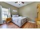 Guest bedroom with full bed and wood flooring at 4615 Cumbrian Lakes Dr, Kissimmee, FL 34746