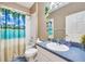 Full bathroom with tub shower combo and blue vanity at 4615 Cumbrian Lakes Dr, Kissimmee, FL 34746