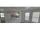 Open kitchen with white cabinets and quartz counters at 1058 N Davis Ave, Lakeland, FL 33805