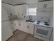 White kitchen with stainless steel appliances at 1058 N Davis Ave, Lakeland, FL 33805