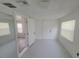 Spacious bonus room with mirrored wall and access to another room at 1058 N Davis Ave, Lakeland, FL 33805