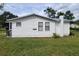 White cottage with two windows at 1058 N Davis Ave, Lakeland, FL 33805