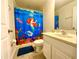 Bathroom with a mermaid-themed shower curtain at 901 Las Fuentes Dr, Kissimmee, FL 34746