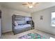 Bedroom with bunk beds and playful rug at 901 Las Fuentes Dr, Kissimmee, FL 34746