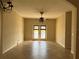 Spacious dining room with access to backyard and tile flooring at 13638 Guildhall Cir, Orlando, FL 32828