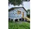 New house under construction, exterior wrap, steps, and small deck at 2330 Greenway, Sanford, FL 32771