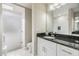 Modern bathroom with white subway tile and dark vanity at 2305 Flaming Arrow Dr, Lakeland, FL 33813