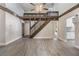 Open living room featuring a loft, wood staircase, and hardwood floors at 2305 Flaming Arrow Dr, Lakeland, FL 33813