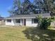 Newly renovated home with a red door and shutters at 1049 Edith Ave, Lakeland, FL 33805