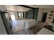 Open concept kitchen with island, white cabinets, and stainless steel appliances at 1049 Edith Ave, Lakeland, FL 33805
