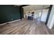 Modern kitchen features island, stainless steel appliances, and dark wood flooring at 1049 Edith Ave, Lakeland, FL 33805
