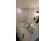 Clean bathroom with marble-look walls and white vanity at 1049 Edith Ave, Lakeland, FL 33805