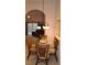 Glass-top dining table with four chairs in a cozy dining area at 511 Rum Run # 33511, Davenport, FL 33897