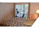 Bedroom with a bed, exercise bike, and access to a balcony at 511 Rum Run # 33511, Davenport, FL 33897